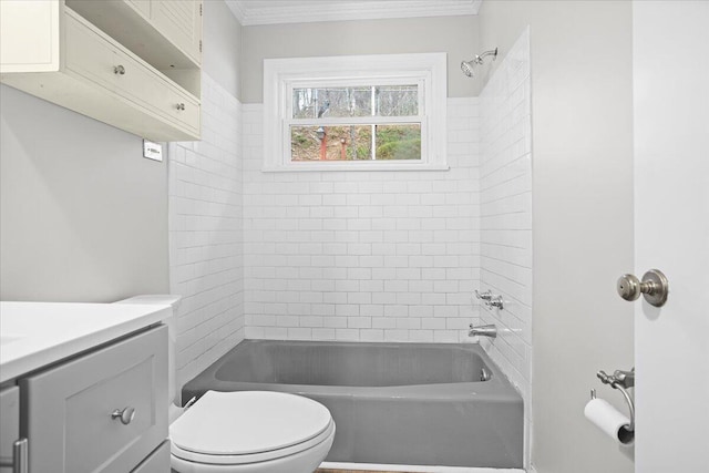 full bathroom with vanity, tiled shower / bath combo, and toilet