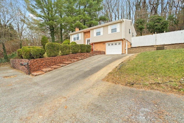 split foyer home featuring a garage