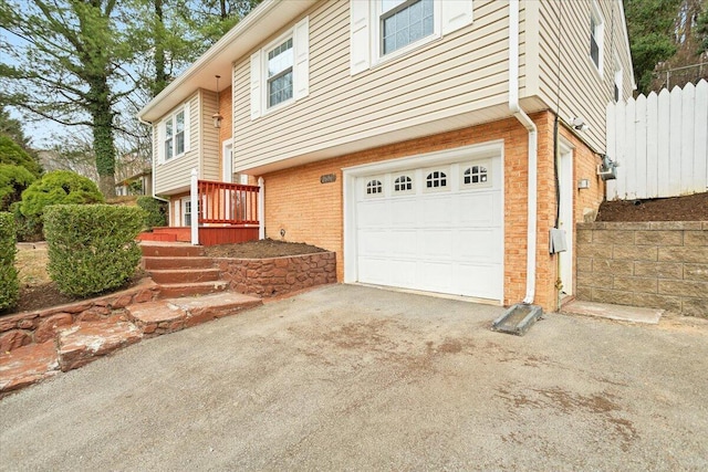 view of side of property with a garage