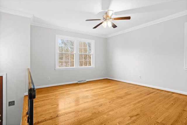 spare room with light wood-type flooring, ceiling fan, and crown molding