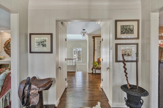 hall with crown molding and dark hardwood / wood-style flooring