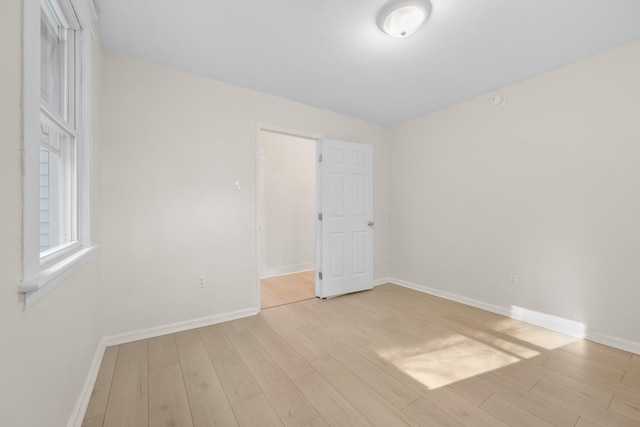 empty room with light wood-type flooring