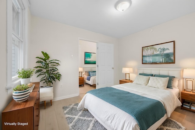 bedroom featuring light wood-type flooring