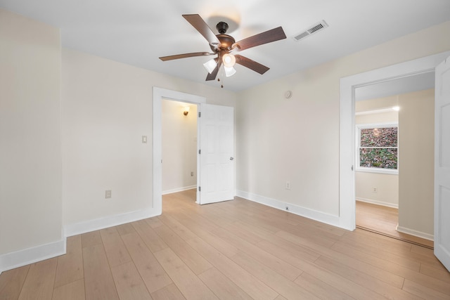 spare room featuring ceiling fan and light hardwood / wood-style floors