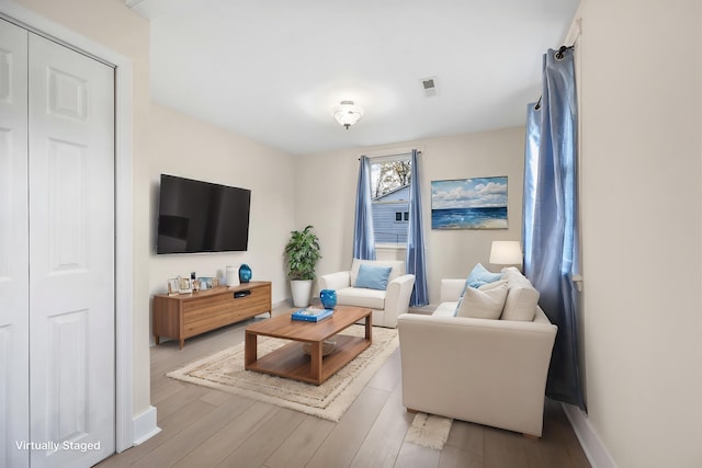 living room with light hardwood / wood-style floors