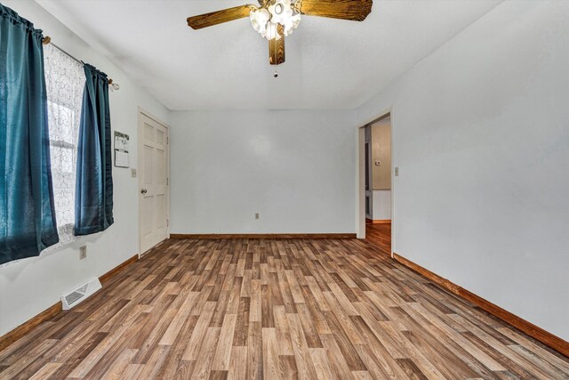 3928 Springwood Rd, Fincastle, VA 24090 - empty room featuring wood finished floors, baseboards, and ceiling fan