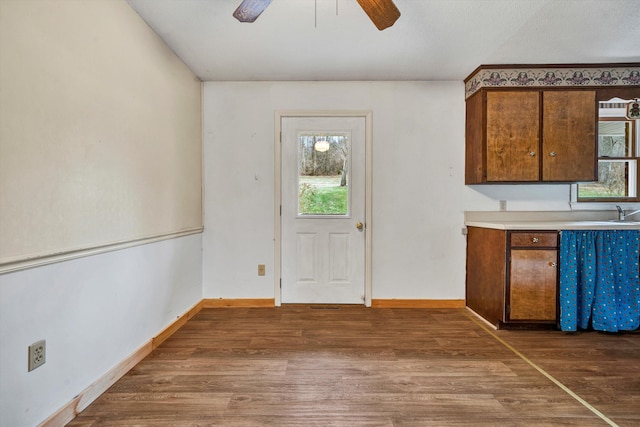 kitchen featuring dark hardwood / wood-style floors and ceiling fan