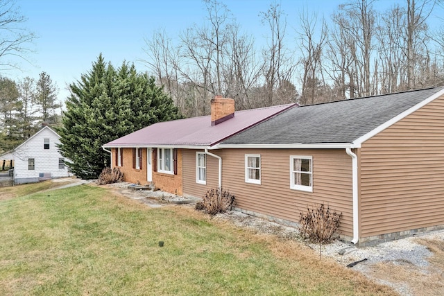 view of home's exterior featuring a lawn