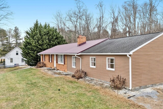 3928 Springwood Rd, Fincastle, VA 24090 - view of home's exterior featuring a chimney, a lawn, and a shingled roof