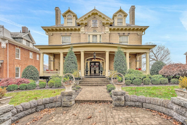 view of front of property with french doors and a porch