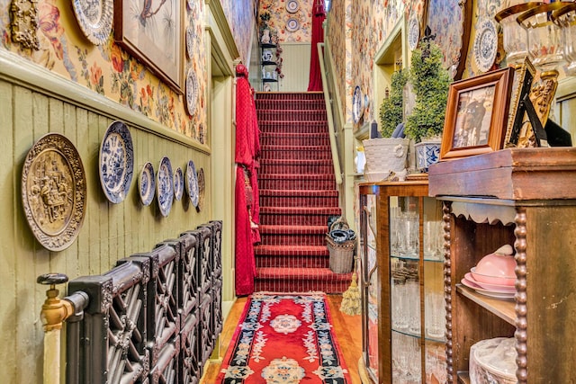 stairs featuring hardwood / wood-style flooring