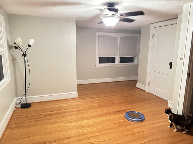 property exterior at dusk with a lawn and central AC unit