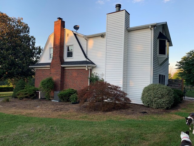 view of outbuilding with a lawn