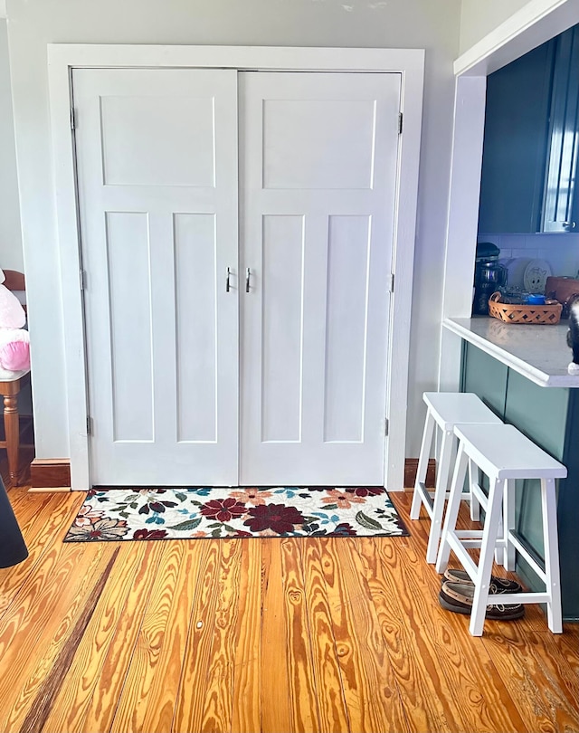 interior space featuring baseboards and wood finished floors