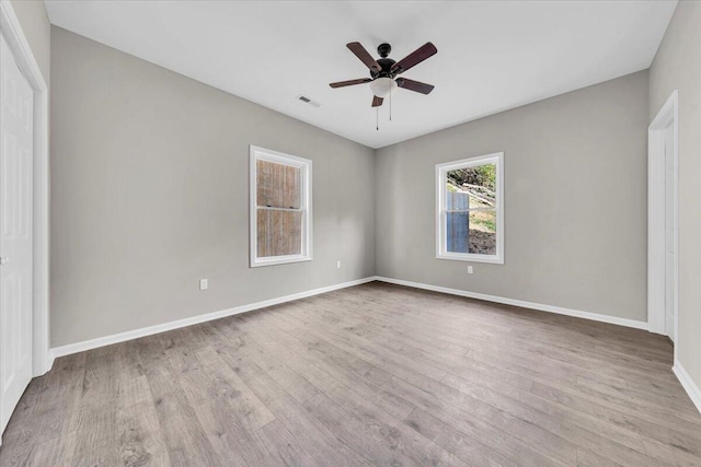 spare room featuring ceiling fan and light hardwood / wood-style floors