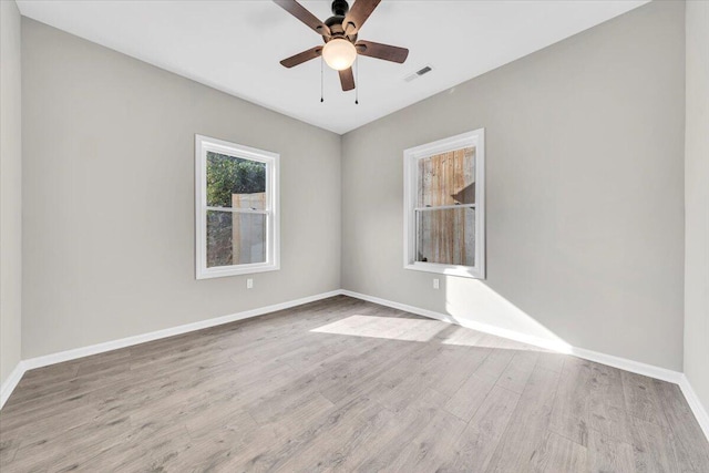 spare room with light hardwood / wood-style flooring and ceiling fan