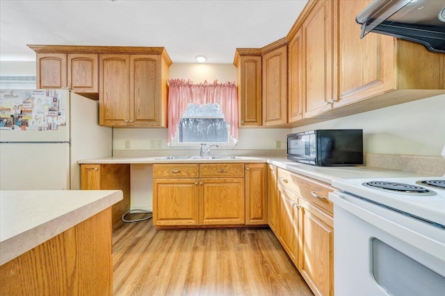 kitchen with ventilation hood, sink, white appliances, and light hardwood / wood-style flooring