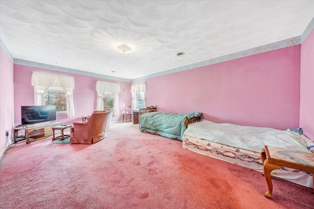 carpeted bedroom with multiple windows and a textured ceiling