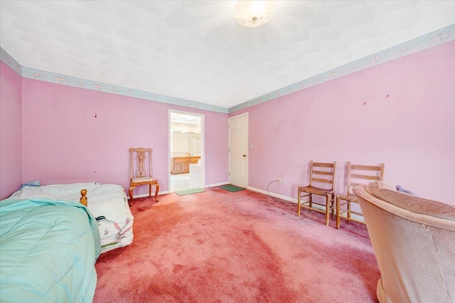 bedroom featuring carpet floors and connected bathroom