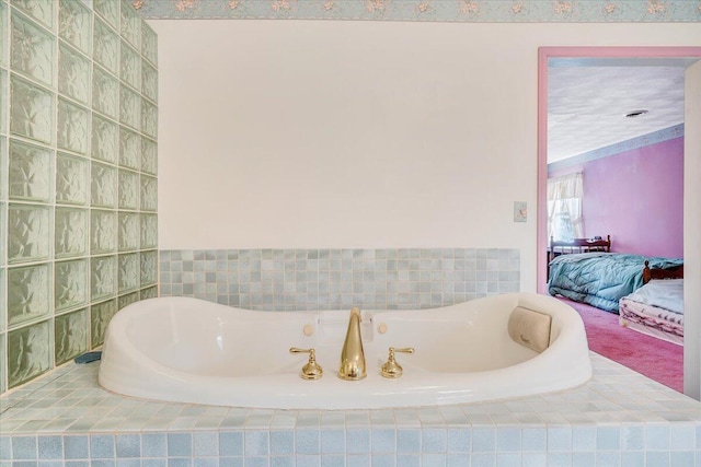 bathroom with a relaxing tiled tub