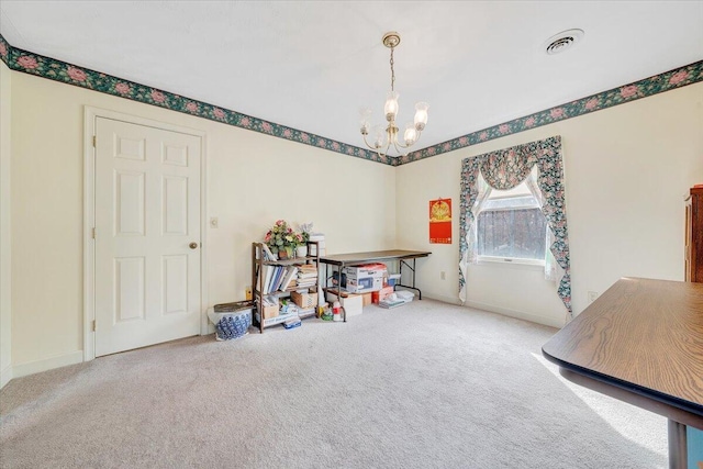 miscellaneous room featuring a chandelier and carpet flooring