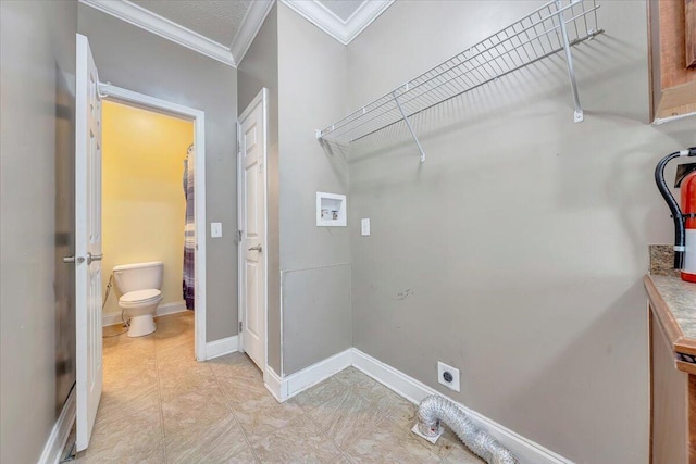 laundry room with hookup for an electric dryer, hookup for a washing machine, and ornamental molding