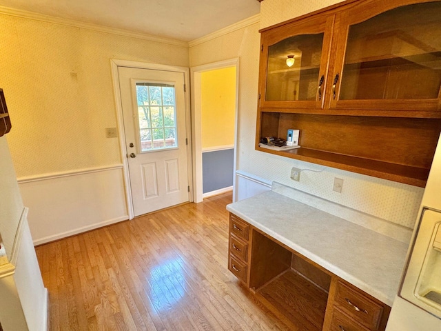 interior space featuring crown molding and light hardwood / wood-style floors