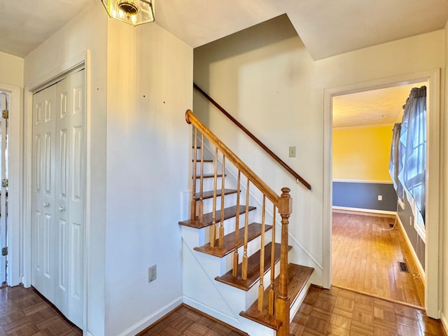 stairway featuring hardwood / wood-style flooring