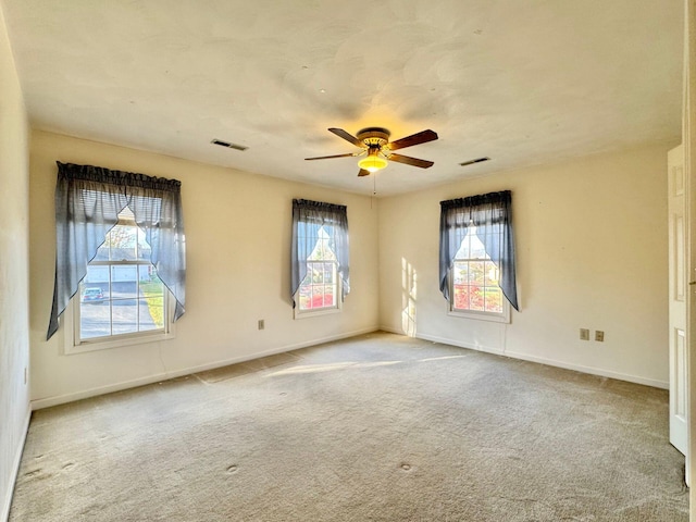 carpeted empty room with ceiling fan