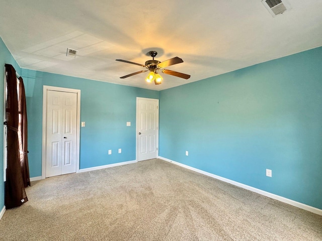 unfurnished bedroom with carpet flooring, ceiling fan, and a closet