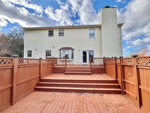 back of house with a wooden deck