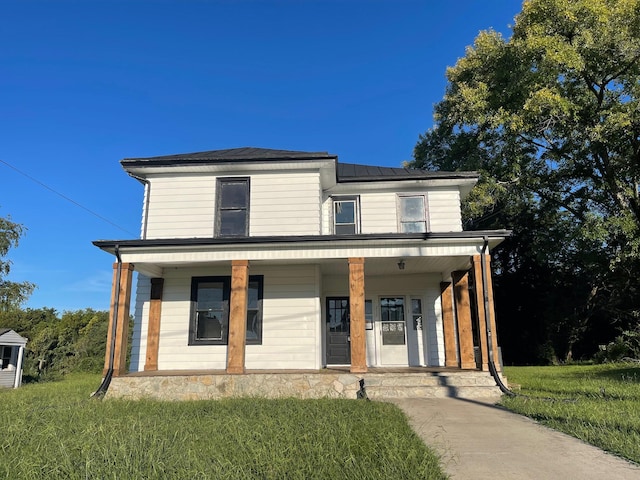 view of front of house with a front lawn and covered porch