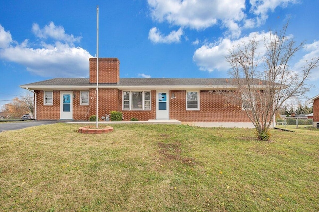 ranch-style home with a front yard