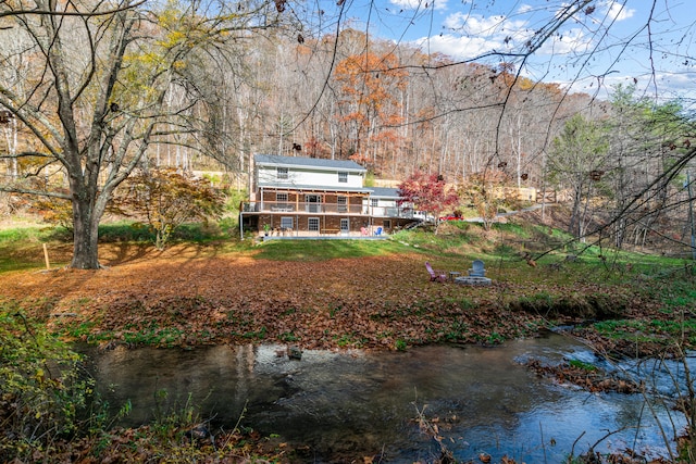 back of house with a water view