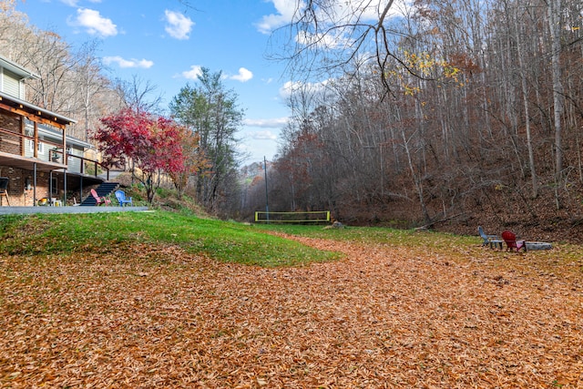 view of yard featuring a wooden deck