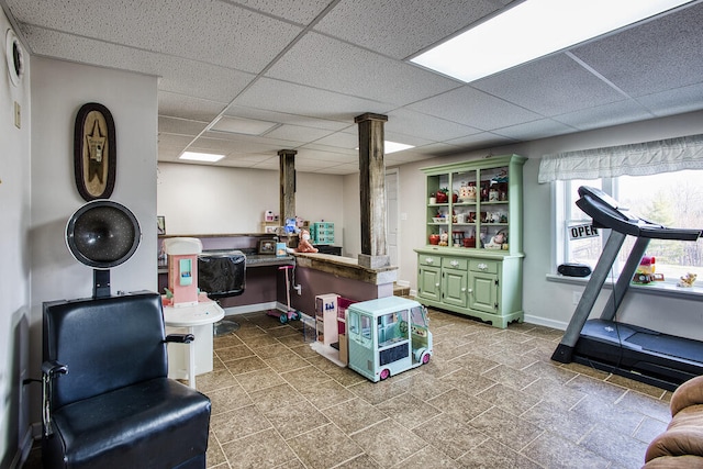 interior space featuring a drop ceiling