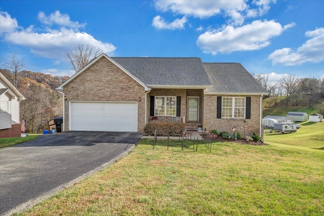 view of front facade featuring a front lawn and a garage