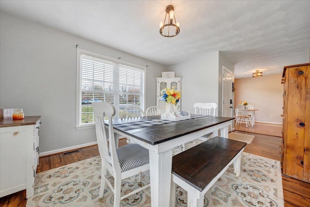 dining area with hardwood / wood-style flooring