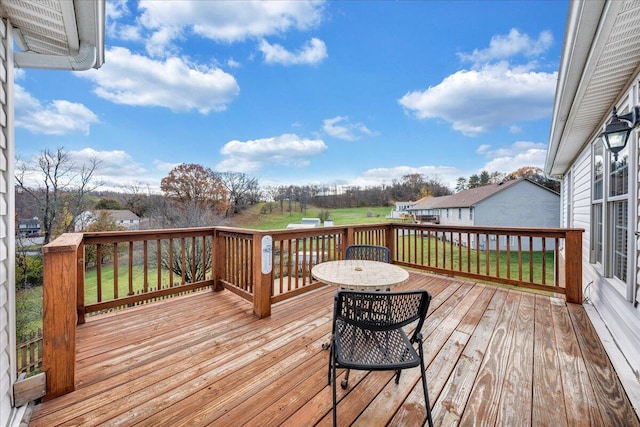 wooden terrace with a yard