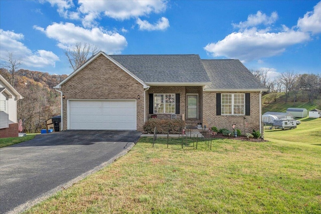 view of front of house featuring a garage and a front yard