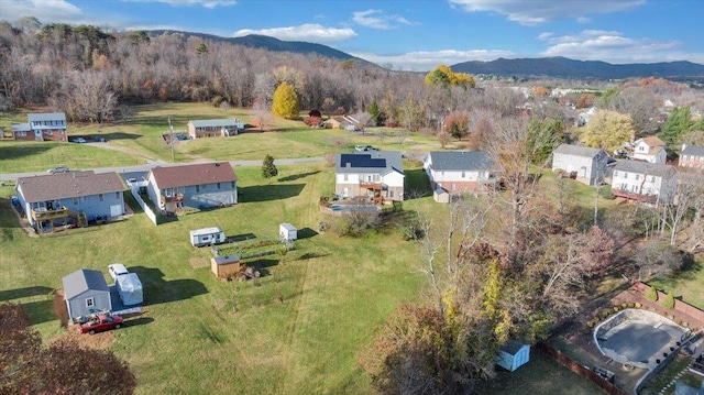 birds eye view of property featuring a mountain view