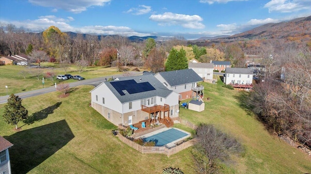 drone / aerial view featuring a mountain view