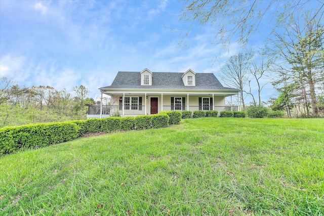 cape cod house with a front lawn and a porch