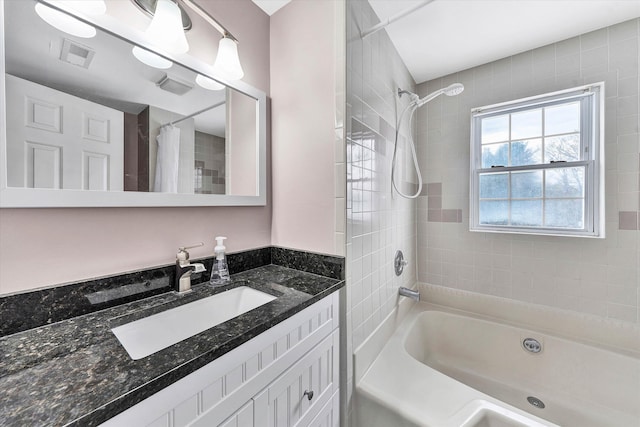 bathroom featuring shower / bath combination with curtain and vanity