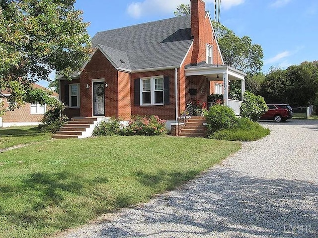 view of front of home featuring a front yard and a porch