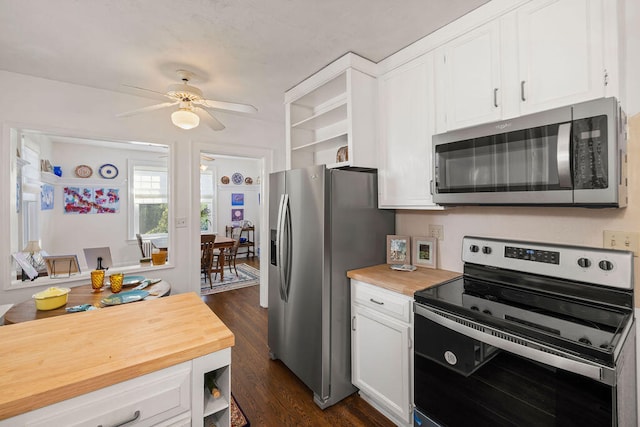 kitchen with white cabinetry, ceiling fan, dark wood-type flooring, wooden counters, and appliances with stainless steel finishes