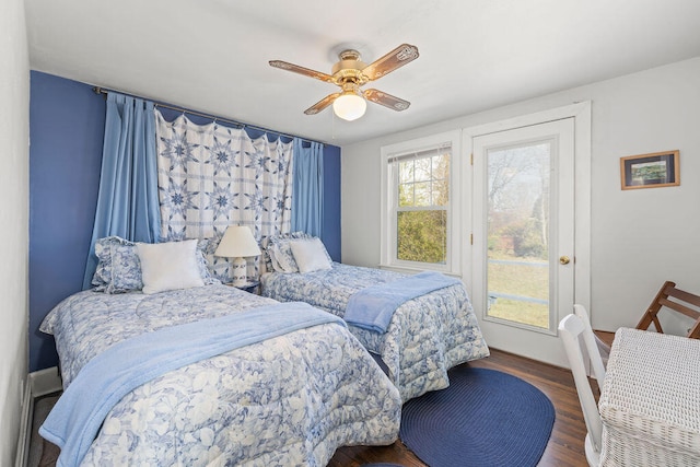 bedroom featuring ceiling fan and dark wood-type flooring