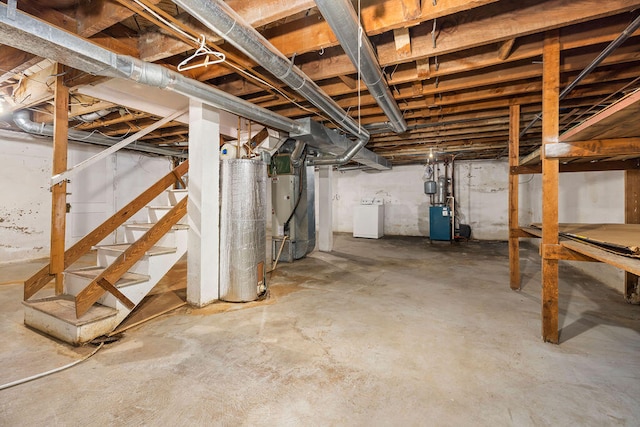 basement featuring washer / clothes dryer, heating unit, and water heater