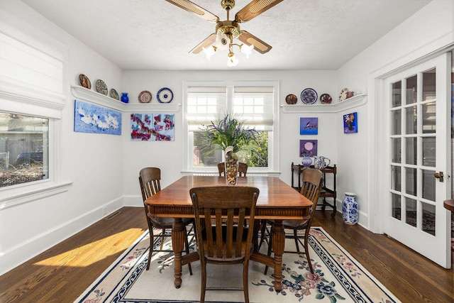 dining room featuring ceiling fan and dark wood-type flooring