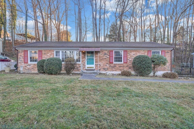 ranch-style home with a front yard